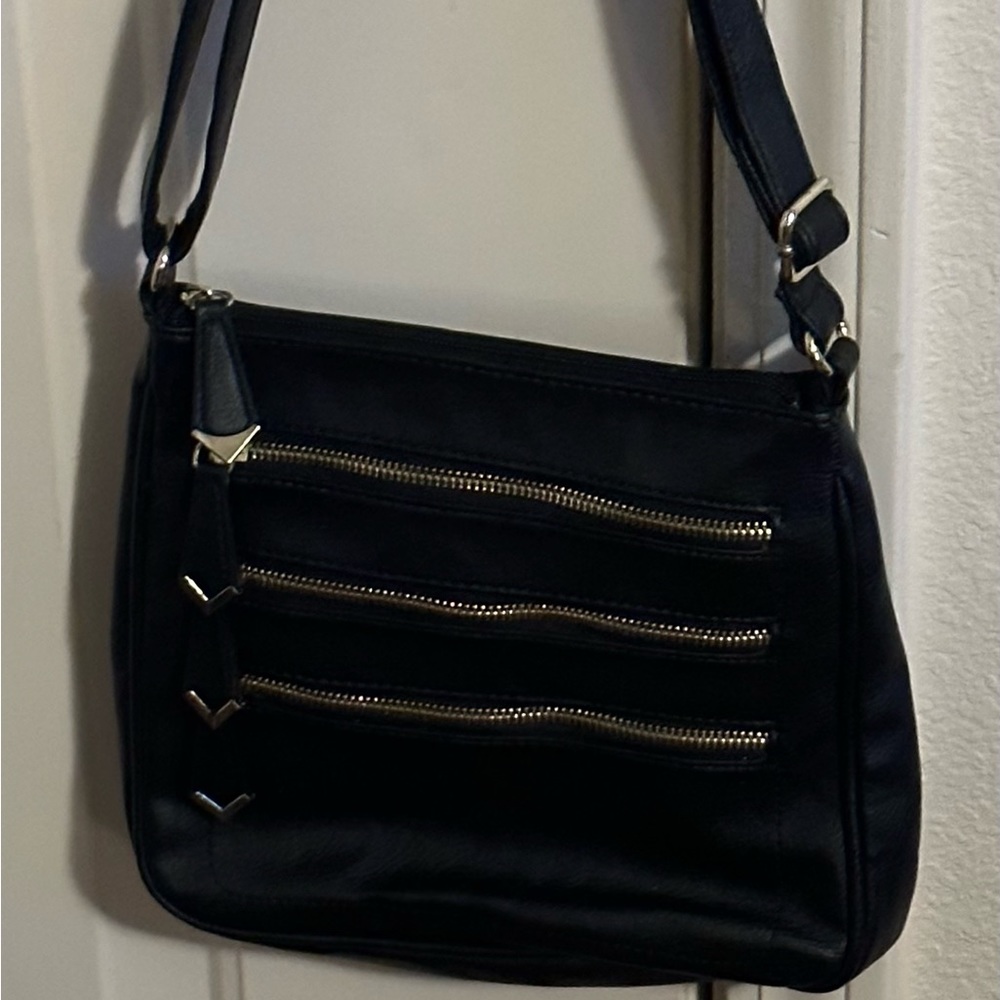 Great condition black with gold zippers small/medium Cross body bag.